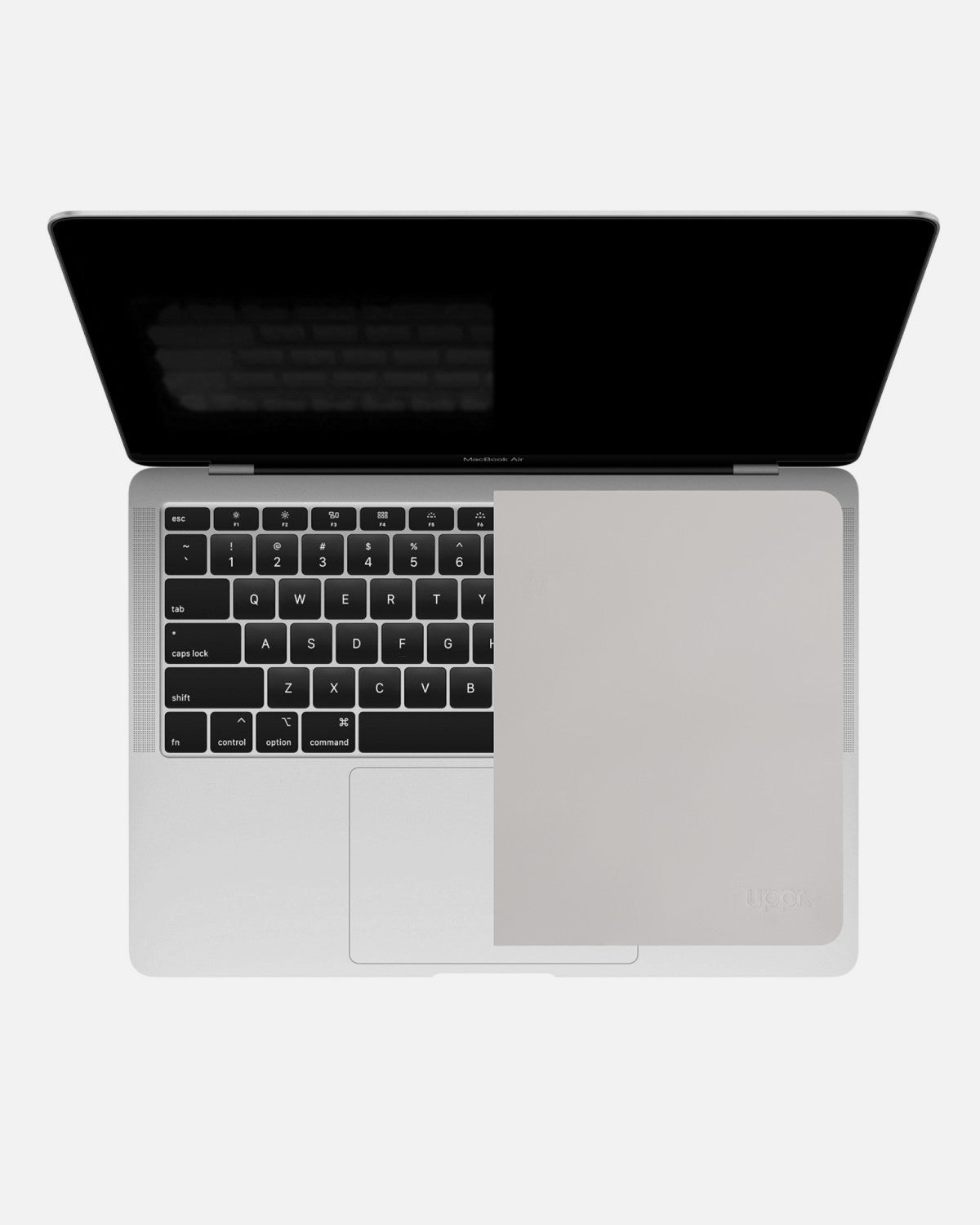 Top-down view of a MacBook Air with the GhostBlanket liner half covering the keyboard showing the fitting
