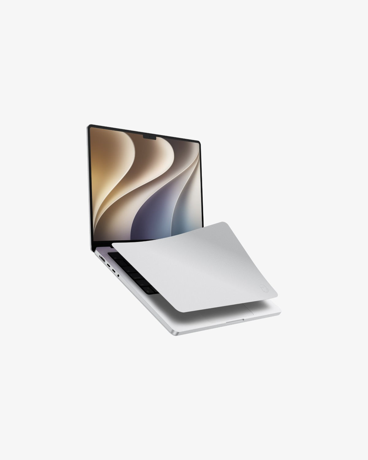 A MacBook open with a gray GhostBlanket microfiber liner laid over the keyboard