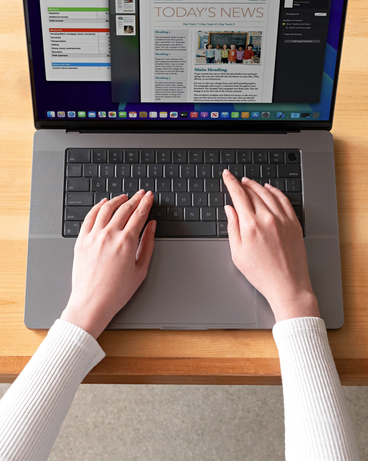 Hands typing on a MacBook fitted with a GhostCover FlexType keyboard protector