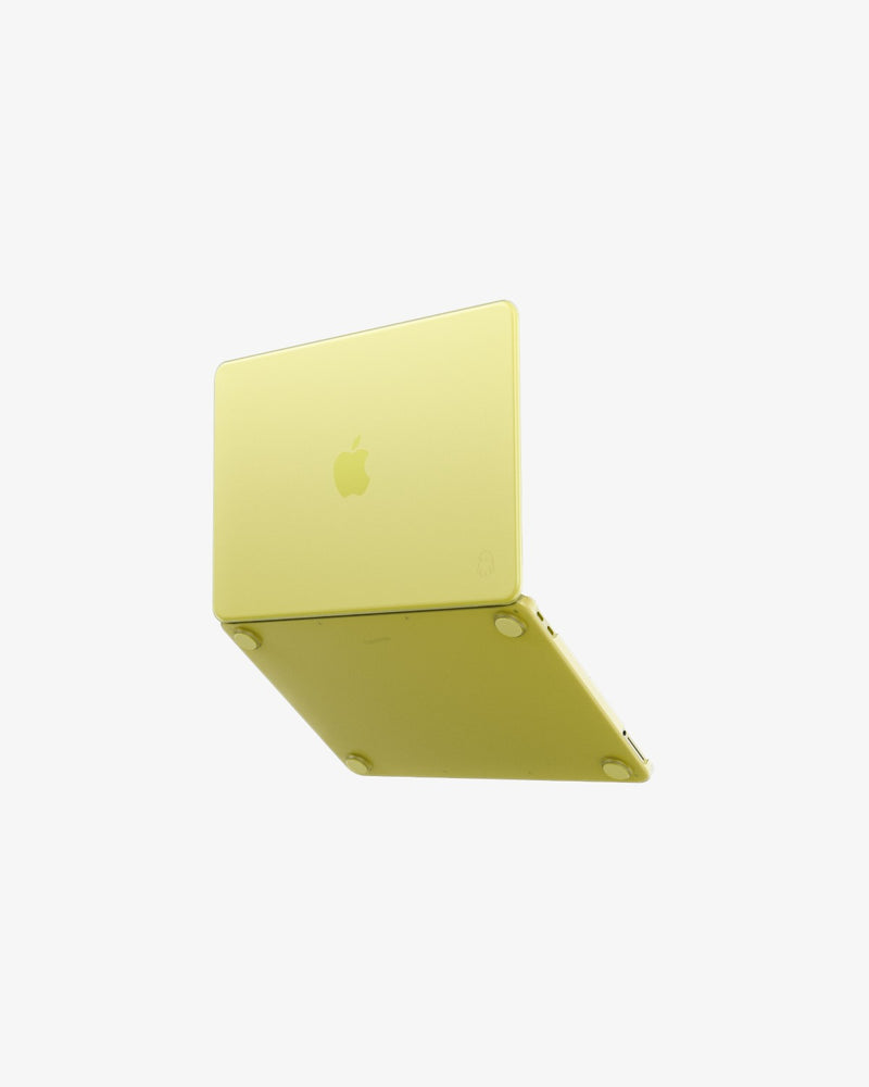 A citrus MacBook Neo in a transluscent citrus GhostShell Frost hardshell case