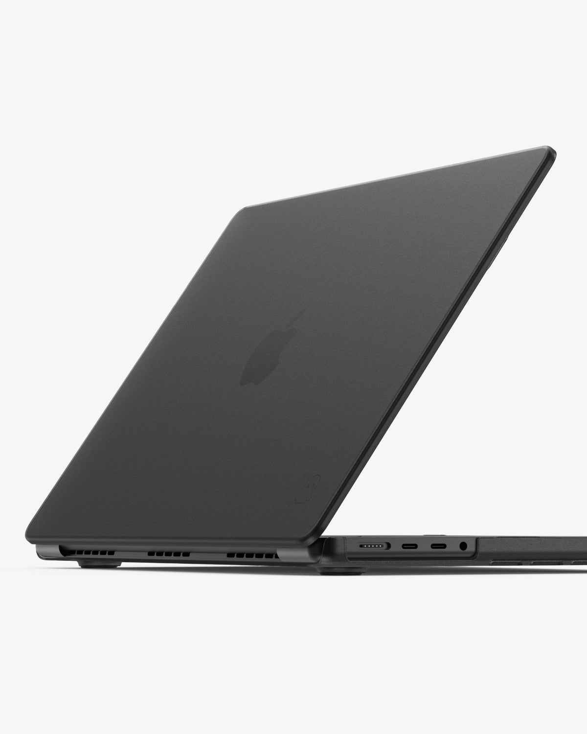 Side view of a closed MacBook Pro in a translucent black GhostShell Frost case with ports exposed